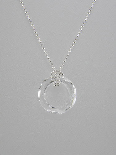 Sterling silver thin ball or rolo chain is knotted around round crystal ring pendant