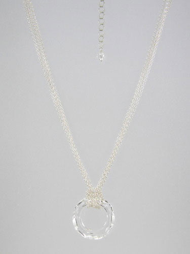 Fine round rolo link sterling silver chain layered and knotted around 30 mm round clear crystal ring pendant.