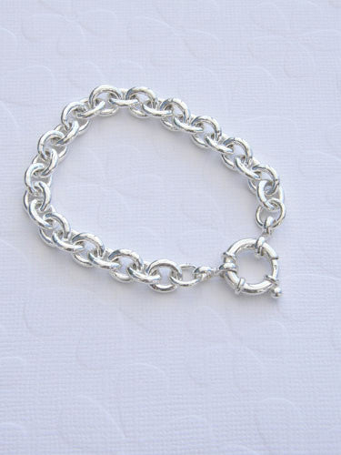 A thick 9 mm slightly oval sterling sliver chain with a large silver clasp. available in 7