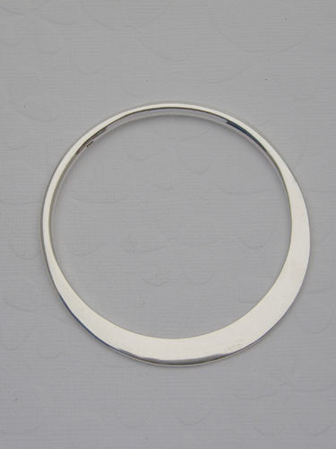 A solid round bangle that can be left plain or can be hand stamped with letters and/or numbers.