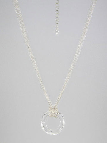 Fine round rolo link sterling silver chain layered and knotted around 30 mm round clear crystal ring pendant.